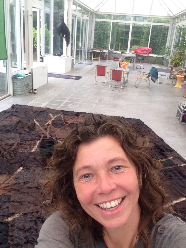 Linda in front of L(h)andschap, a work from 1997 made out of 40 different second hand fur coats.
